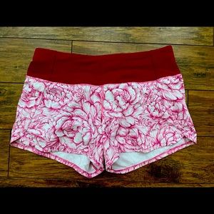 Lululemon shorts size 4 burgundy band and flowers.